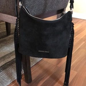 Black suede Michael Kors purse with fringe 😍